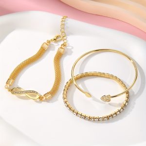 A Set of Three Women'S Bracelets And Bangles Featuring Wireless Symbols And Heart Designs Adorned with Rhinestones.